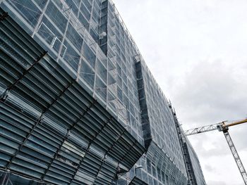 Low angle view of skyscraper against sky