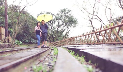 Man standing on railroad track