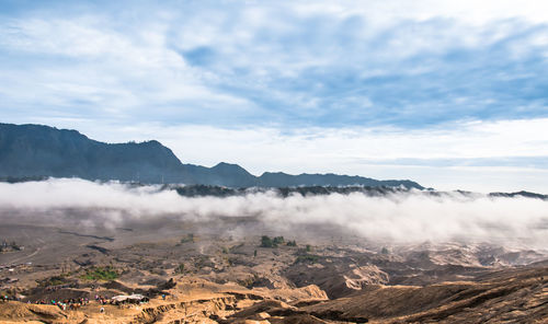 Aerial view of mountain range against sky