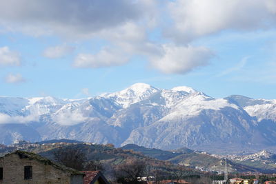 Scenic view of snowcapped mountains against sky