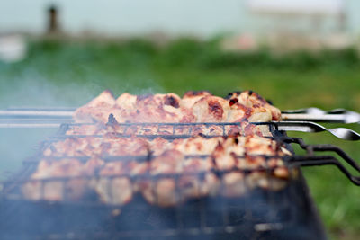 Close-up of meat on barbecue grill