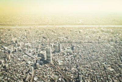 High angle view of crowd in city against sky