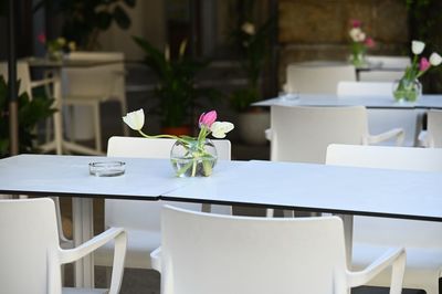 Empty chairs and tables in restaurant