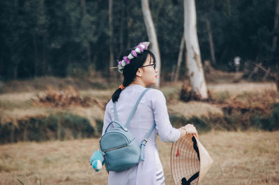 Woman walking on field