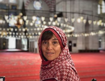 Portrait of smiling woman in mosque