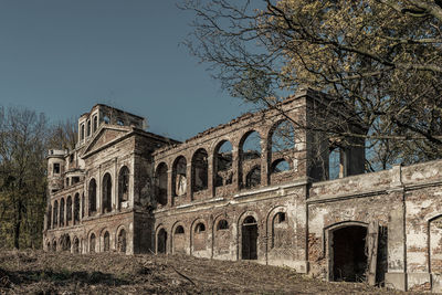 Low angle view of old building against clear sky