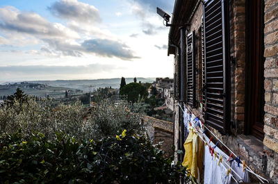 Panoramic view of buildings in city against sky