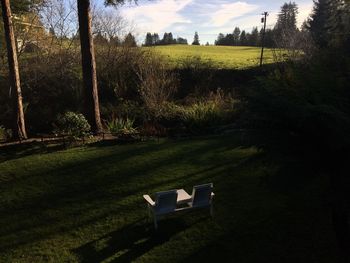 View of golf course on field against sky