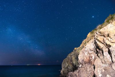 Scenic view of sea against sky at night