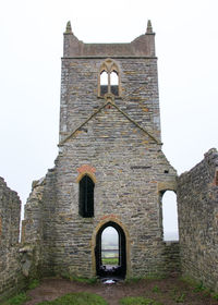 Low angle view of bell tower against sky