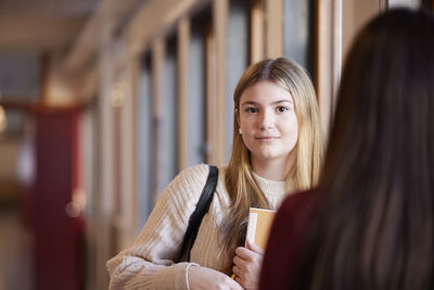 Teenage girl looking at camera