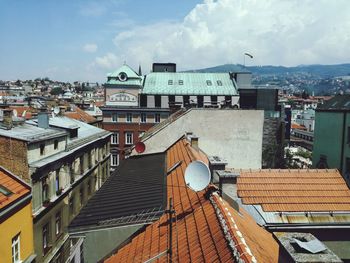 Houses in town against sky