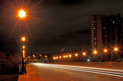 Illuminated street lights at night