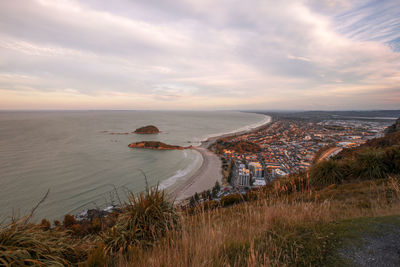 High angle view of sea against sky during sunset