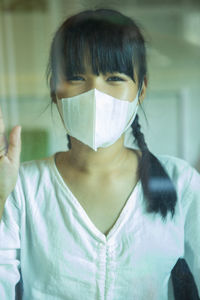 Portrait of girl wearing mask