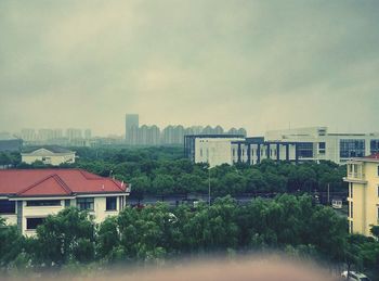 View of city against cloudy sky