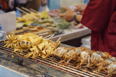 Close-up of meat on barbecue grill