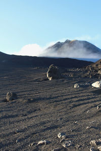 Scenic view of arid landscape against sky