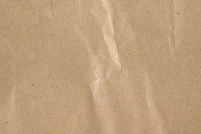 High angle view of paper on sand