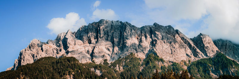 Panoramic view of rocky mountains against sky