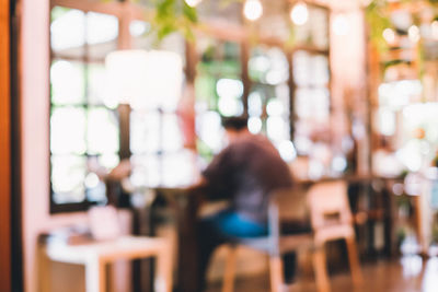 Rear view of people sitting in restaurant