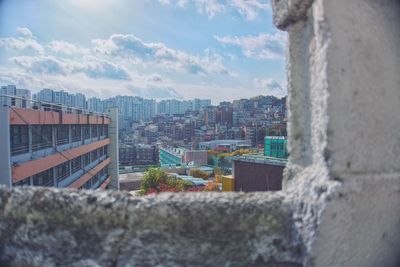 Buildings in town against sky