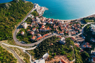 High angle view of townscape by sea