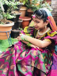 Cute girl sitting outdoors