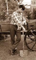 Full length of young man standing in yard