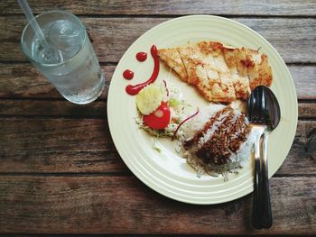 Grilled chicken with rice and salad on plate