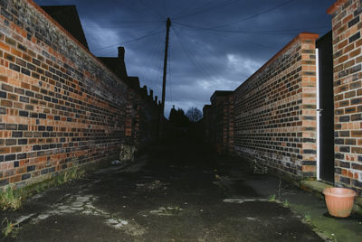 Street amidst buildings against sky