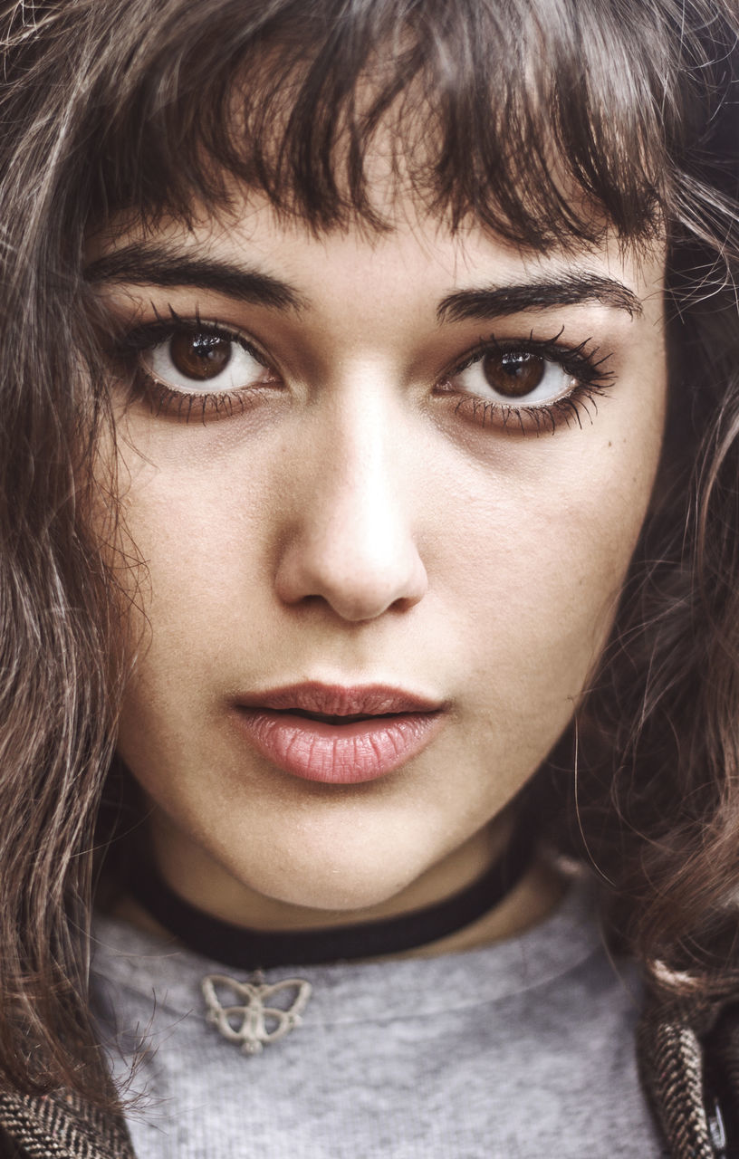 CLOSE-UP PORTRAIT OF YOUNG WOMAN WITH HAIR