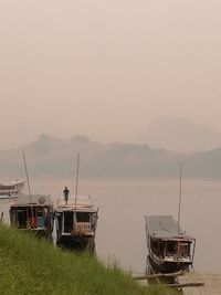 Boat on shore against sky