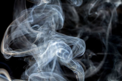 Close-up of smoke against black background