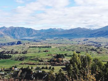 Scenic view of landscape and mountains against sky