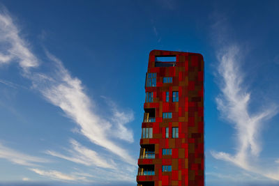 Low angle view of red building against sky