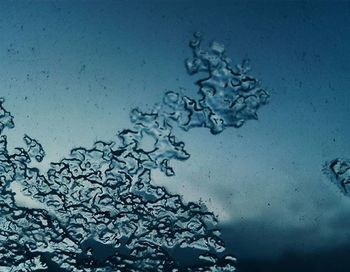 Close-up of water against blue sky