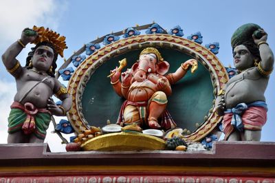 Low angle view of statue against sky