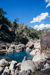 Scenic view of rocks against blue sky