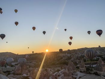 View of hot air balloons against sky during sunset