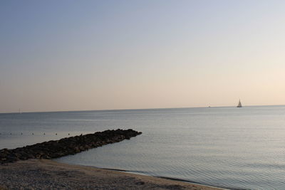 Scenic view of sea against clear sky during sunset