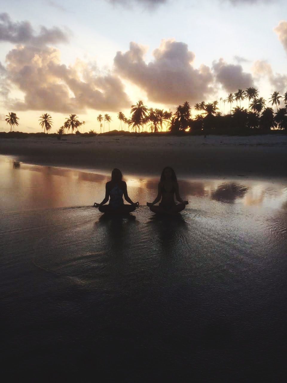 water, sky, reflection, morning, cloud, nature, dusk, silhouette, sunlight, sea, two people, beauty in nature, adult, tranquility, women, lifestyles, leisure activity, land, holiday, sunrise, togetherness, scenics - nature, outdoors, trip, vacation, men, beach, tranquil scene, tree, relaxation, wave, sitting, travel, travel destinations, shore