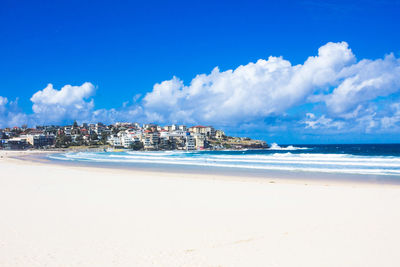 Panoramic view of beach against blue sky