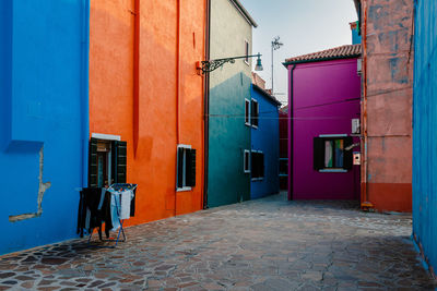 Alley with typical colorful houses in burano