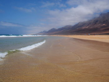 Scenic view of beach against sky