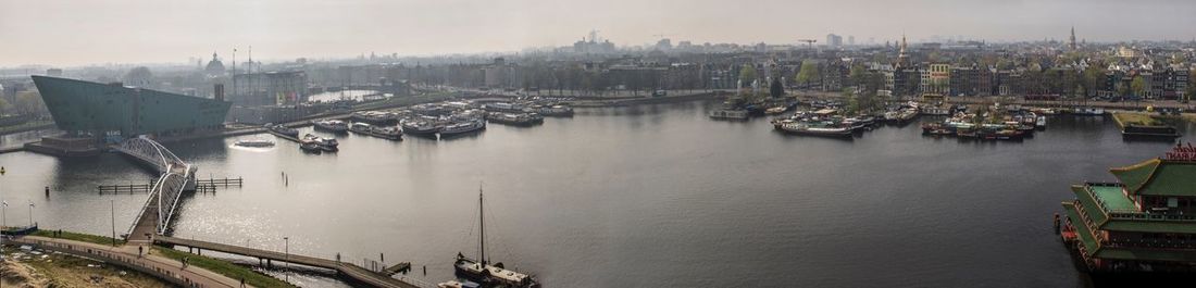 Boats moored in river