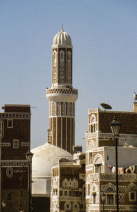 View of buildings in city against sky