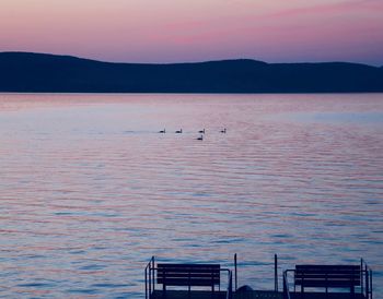 Scenic view of lake against sky during sunset