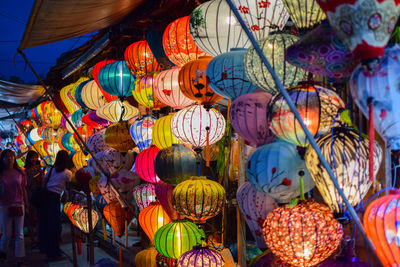 Multi colored lanterns hanging for sale in market