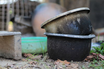 Close-up of old rusty metal on field